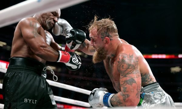 ARLINGTON, TEXAS - NOVEMBER 15: (L-R) Mike Tyson and Jake Paul fight during LIVE On Netflix: Jake Paul vs. Mike Tyson at AT&T Stadium on November 15, 2024 in Arlington, Texas. (Photo by Al Bello/Getty Images for Netflix © 2024)