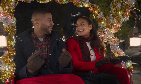 Meet Me Next Christmas. (L to R) Devale Ellis as Teddy and Christina Milian as Layla in Meet Me Next Christmas. Cr. Sophie Giraud/Netflix © 2024.