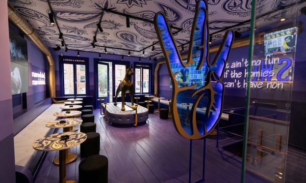 S.W.E.D.'s interior features impressive homages to founder Snoop Dogg, such as a banquette with a giant golden Doberman statue and transparent Westside symbol.